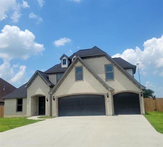 3090 Ethan Symone St, Beaumont, TX 77705 - french country inspired facade featuring a garage