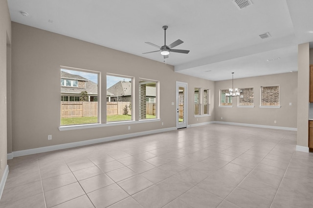 unfurnished living room featuring ceiling fan with notable chandelier and light tile patterned floors