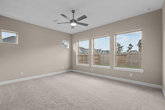 carpeted empty room with ceiling fan