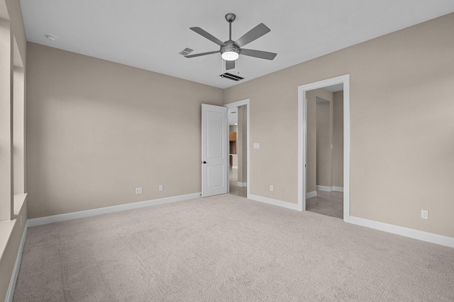 unfurnished bedroom featuring ceiling fan and light colored carpet