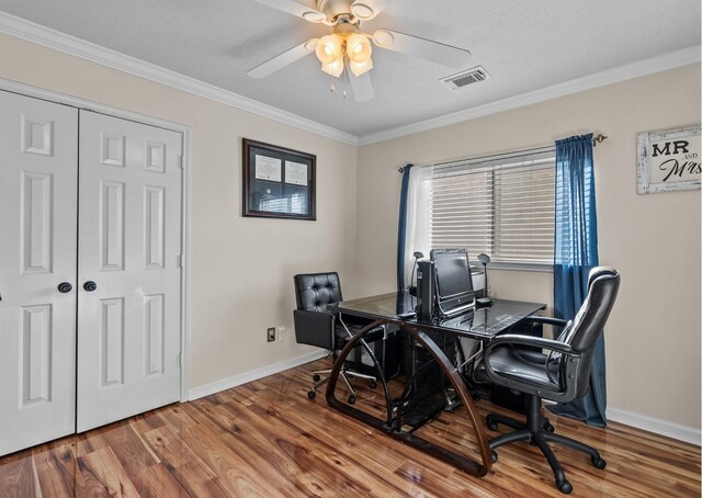 office with ceiling fan, wood-type flooring, and crown molding