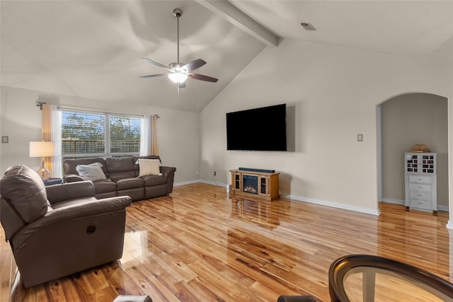 living room with ceiling fan, beam ceiling, high vaulted ceiling, and light hardwood / wood-style flooring