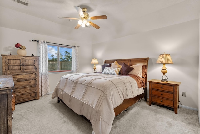 bedroom featuring ceiling fan and light carpet