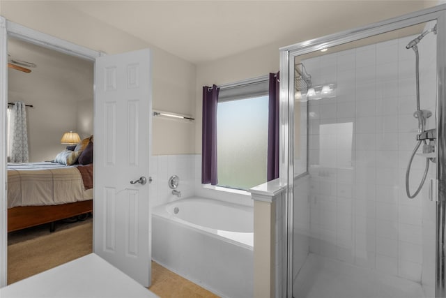 bathroom featuring tile patterned floors and independent shower and bath