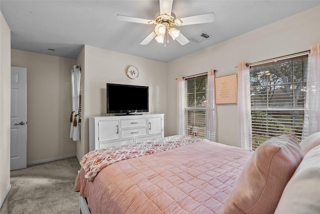 bedroom featuring light carpet and ceiling fan