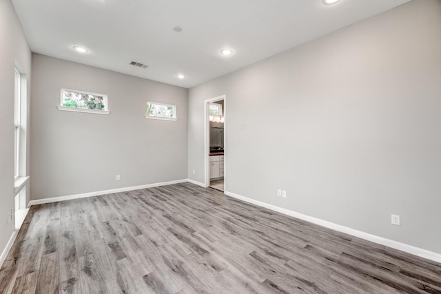 unfurnished room featuring light hardwood / wood-style floors