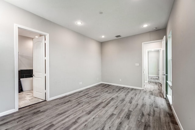 empty room with light hardwood / wood-style floors