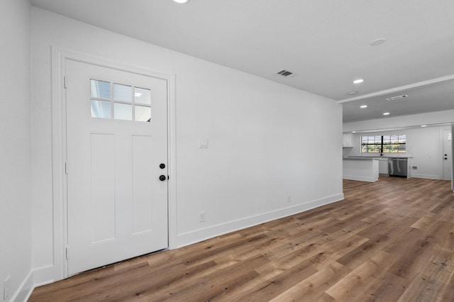 entrance foyer with hardwood / wood-style floors