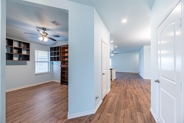 hallway with dark hardwood / wood-style floors