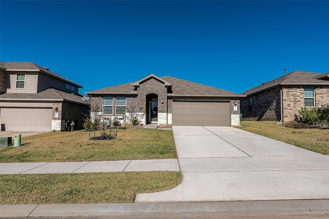 view of front of house with a garage and a front lawn