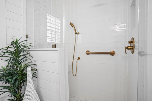 bathroom with tiled shower