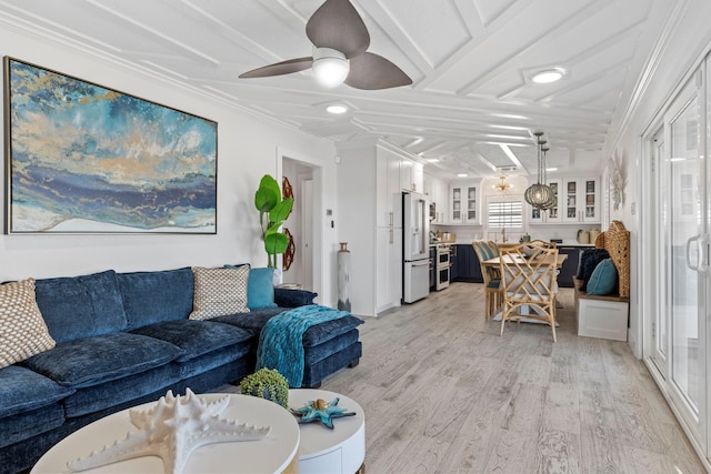 living room with ceiling fan, crown molding, and light hardwood / wood-style flooring