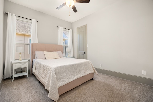 bedroom with multiple windows, carpet floors, and ceiling fan