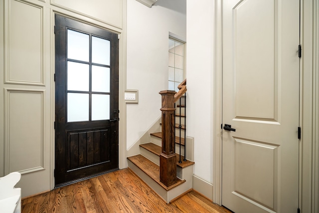 entryway with light hardwood / wood-style flooring