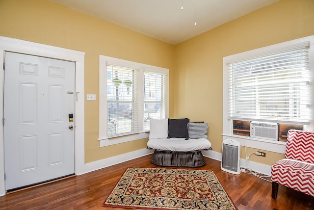 sitting room with cooling unit and dark hardwood / wood-style floors