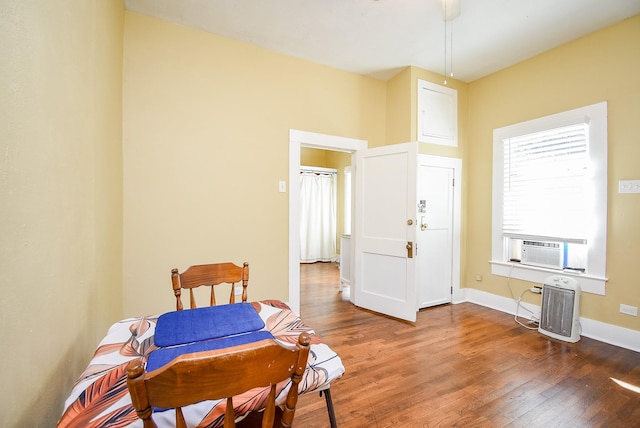 interior space with dark hardwood / wood-style floors and cooling unit