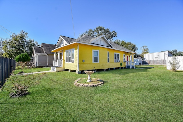 view of side of home featuring a yard