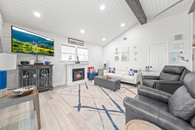 living room featuring wooden ceiling, light wood-type flooring, and vaulted ceiling with beams