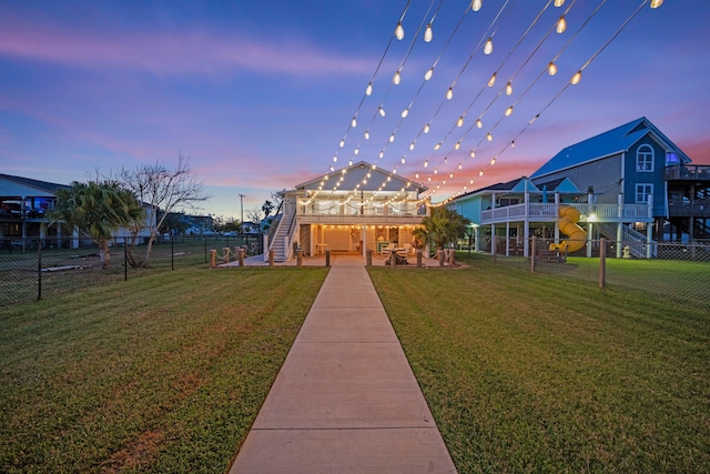 view of property's community with a patio area and a yard