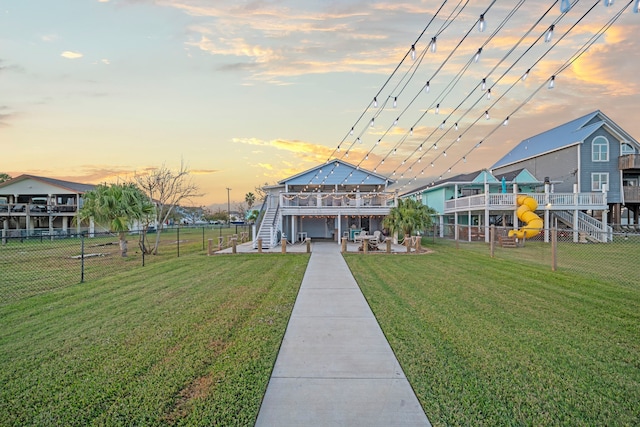 view of community with a yard and a patio area