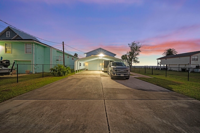 view of front of house featuring a yard and a garage