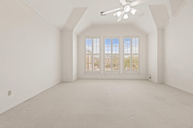 additional living space with light carpet, vaulted ceiling, and ceiling fan