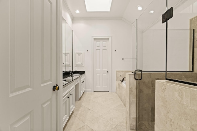 bathroom with tile patterned flooring, vanity, separate shower and tub, and vaulted ceiling with skylight