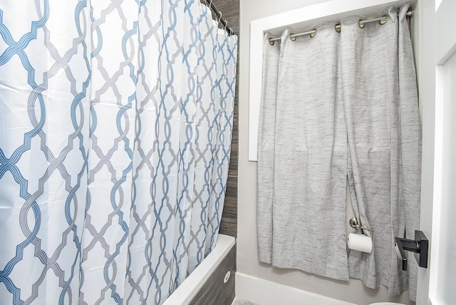 bathroom featuring shower / bath combination with curtain