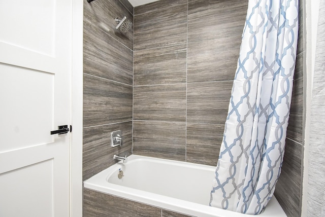 bathroom featuring shower / bathtub combination with curtain