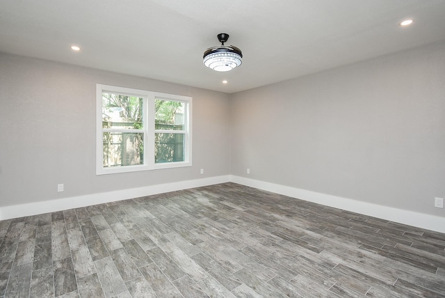 spare room with hardwood / wood-style flooring