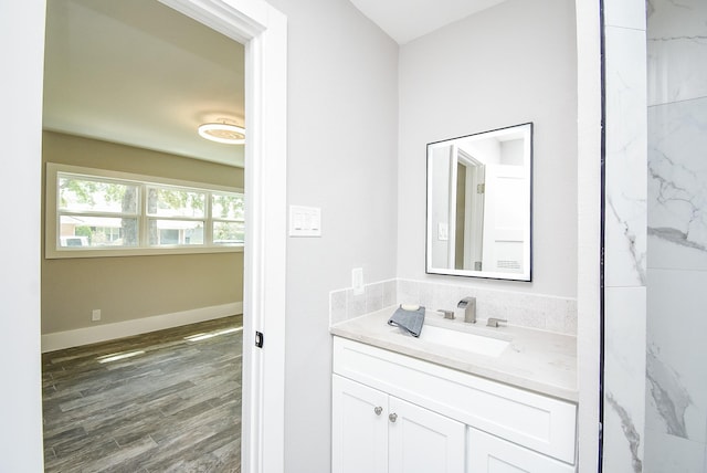 bathroom with vanity and hardwood / wood-style flooring