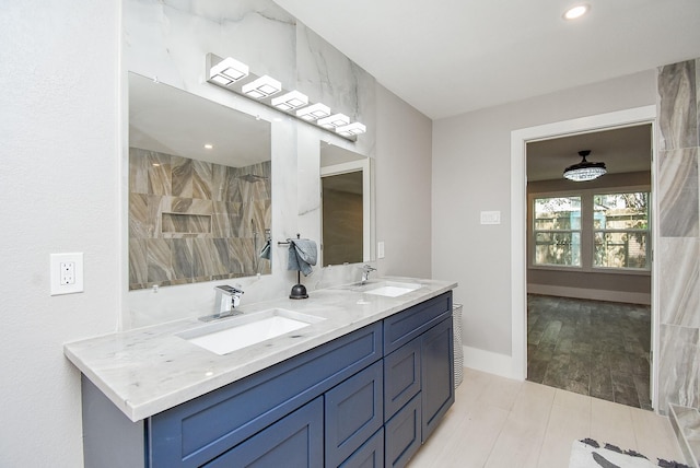 7618 Highmeadow Dr, Houston, TX 77063 - full bathroom with double vanity and wood finished floors