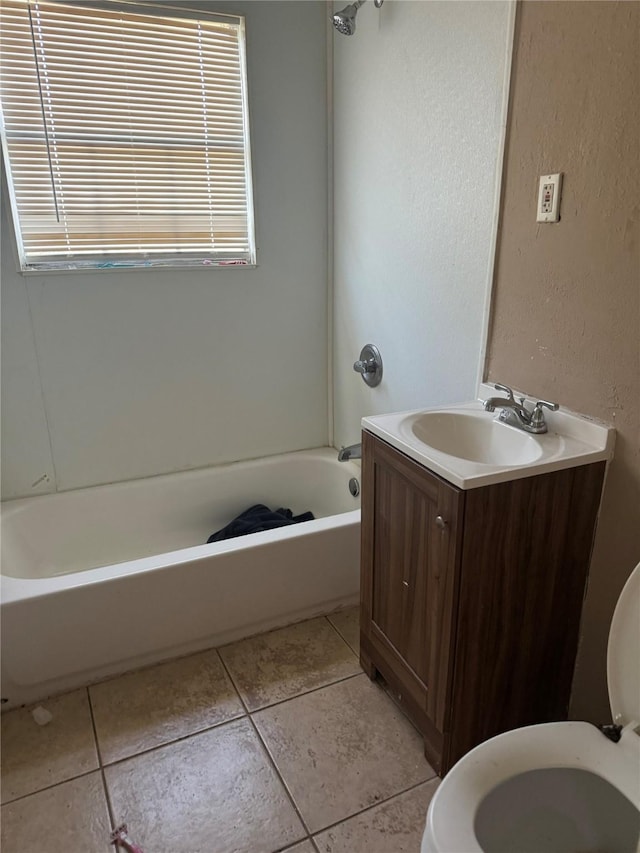 full bathroom with tile patterned floors, shower / tub combination, vanity, and toilet