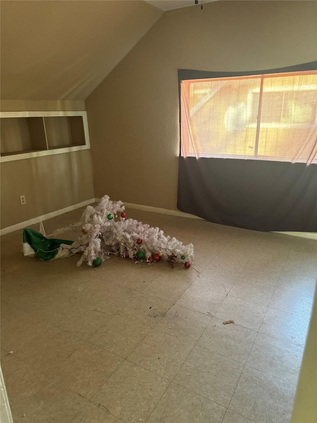 bonus room with vaulted ceiling