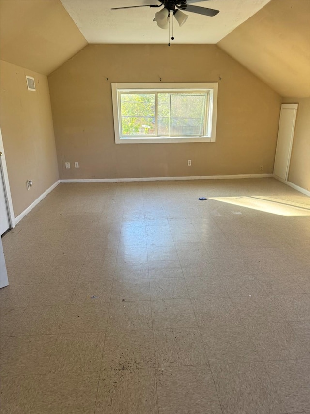 additional living space with ceiling fan and lofted ceiling