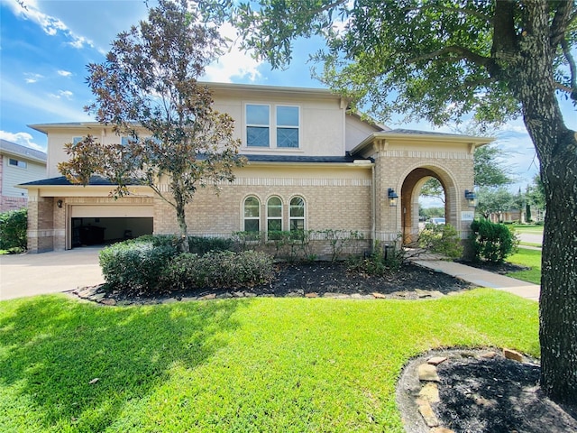 view of front of house with a garage and a front lawn