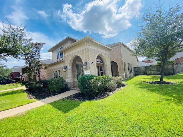 view of front of property with a front lawn