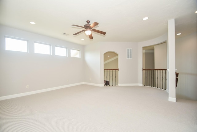 spare room with ceiling fan and carpet floors