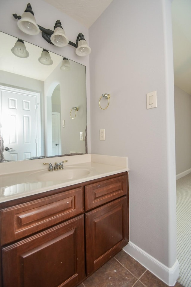 bathroom with tile patterned flooring and vanity