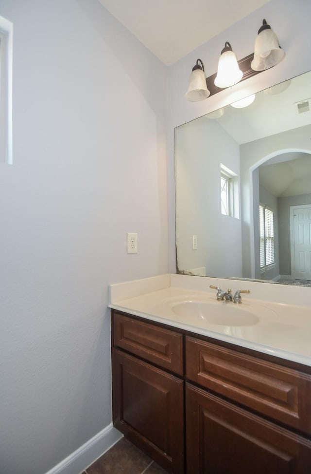 bathroom with tile patterned floors and vanity