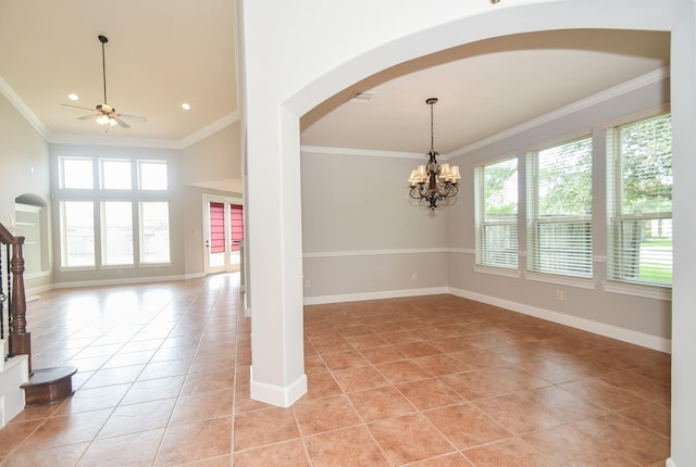 spare room featuring ceiling fan with notable chandelier, light tile patterned flooring, and crown molding