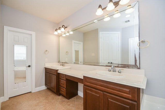 bathroom with tile patterned floors and vanity