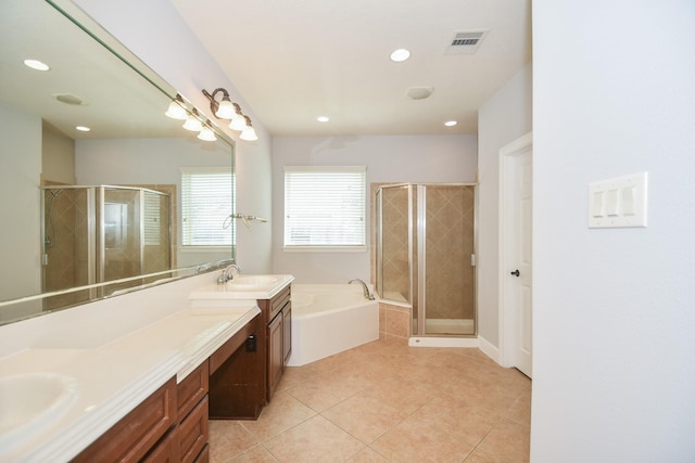 bathroom with tile patterned flooring, vanity, and plus walk in shower