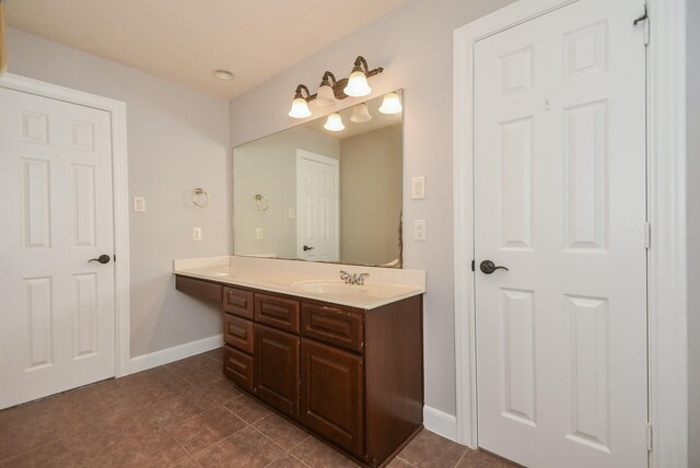 bathroom with tile patterned flooring and vanity