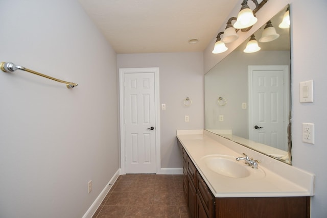 bathroom with tile patterned flooring and vanity