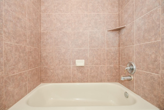 bathroom featuring a tub to relax in