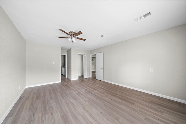 empty room featuring ceiling fan and wood-type flooring