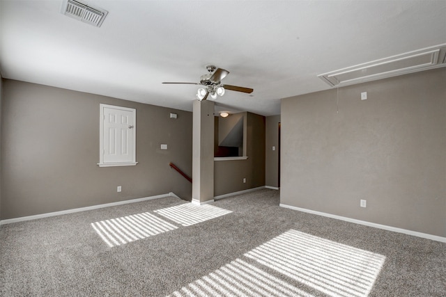 carpeted spare room with ceiling fan