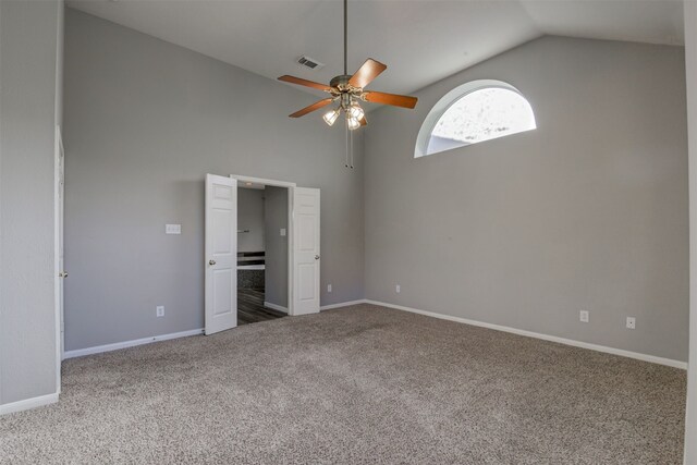 unfurnished bedroom with ceiling fan, carpet, and high vaulted ceiling