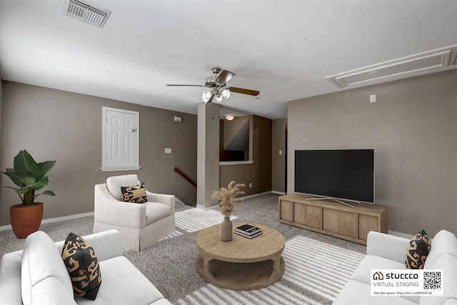 living room featuring carpet flooring and ceiling fan